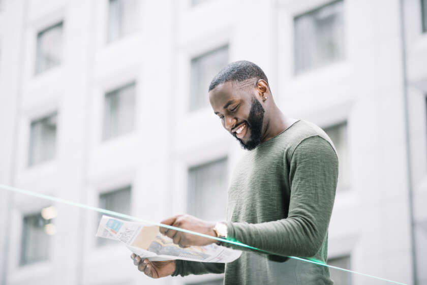 smiling-man-reading-newspaper